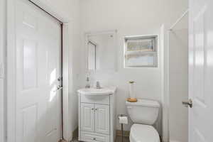 Full bathroom with vanity and a shower