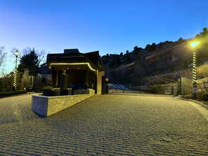 View of home's community featuring a gate and a patio area