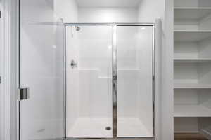 Bathroom featuring a shower stall
