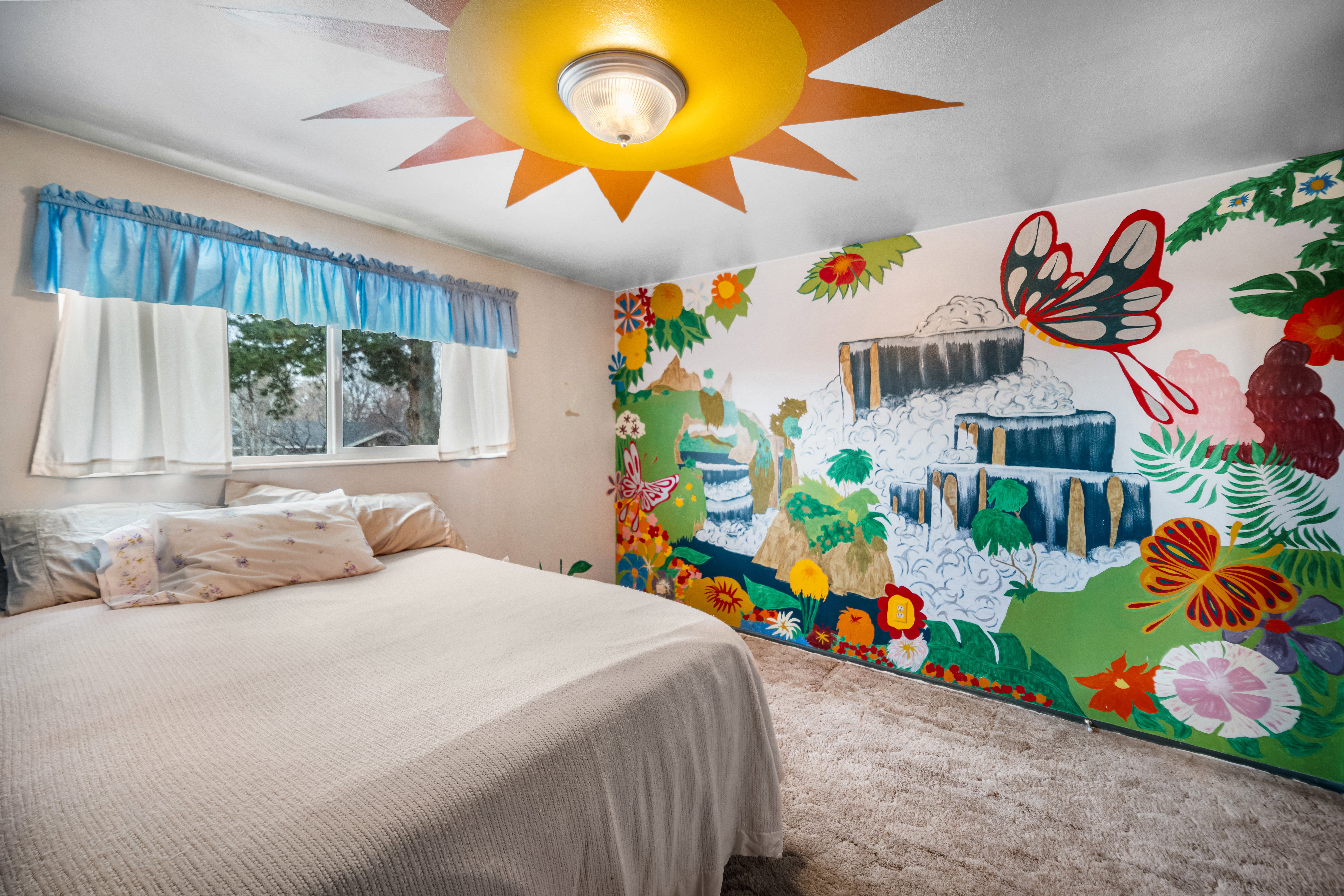 Bedroom with carpet flooring and a ceiling fan