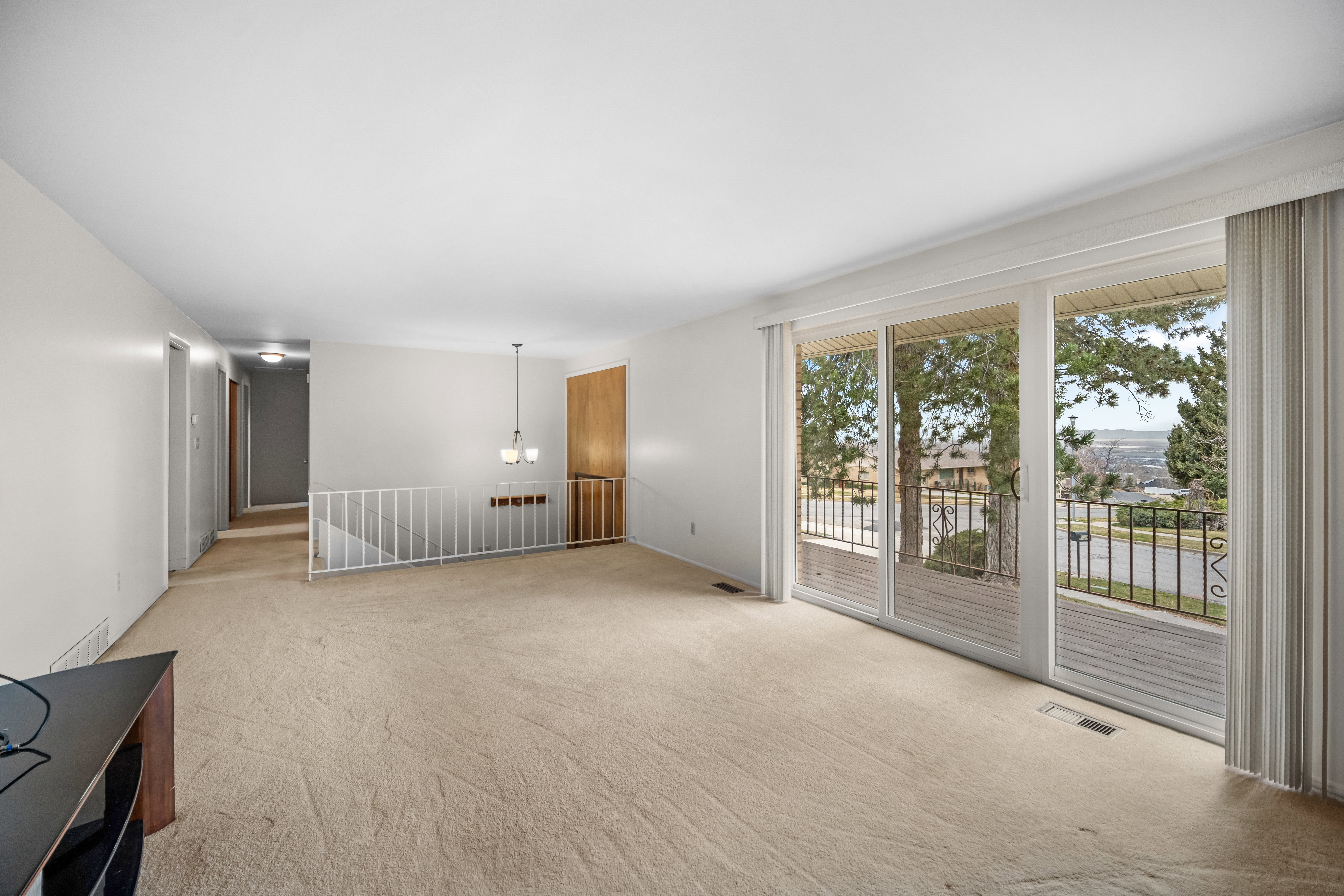 Spare room featuring light colored carpet
