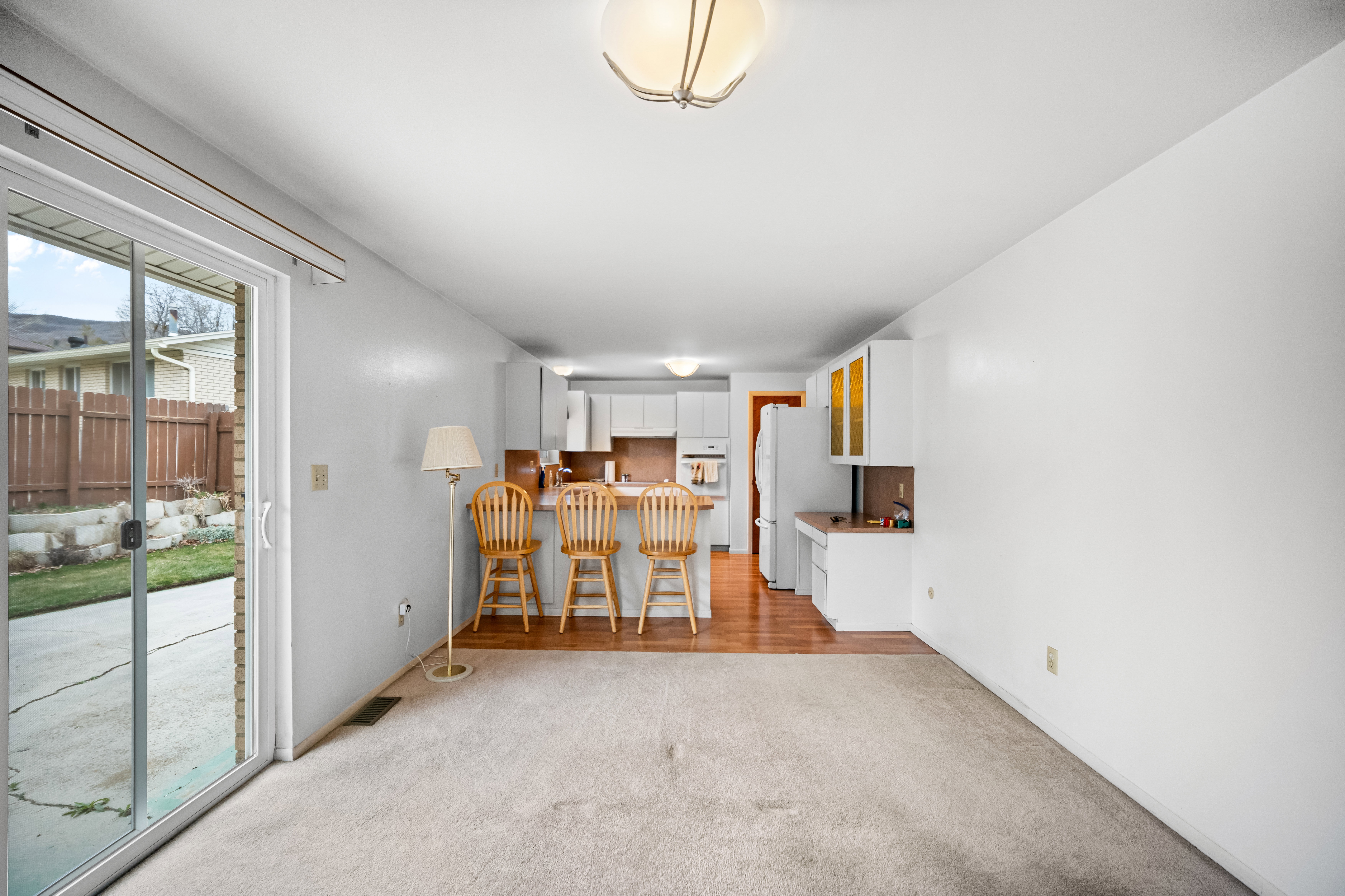 Dining space featuring light colored carpet