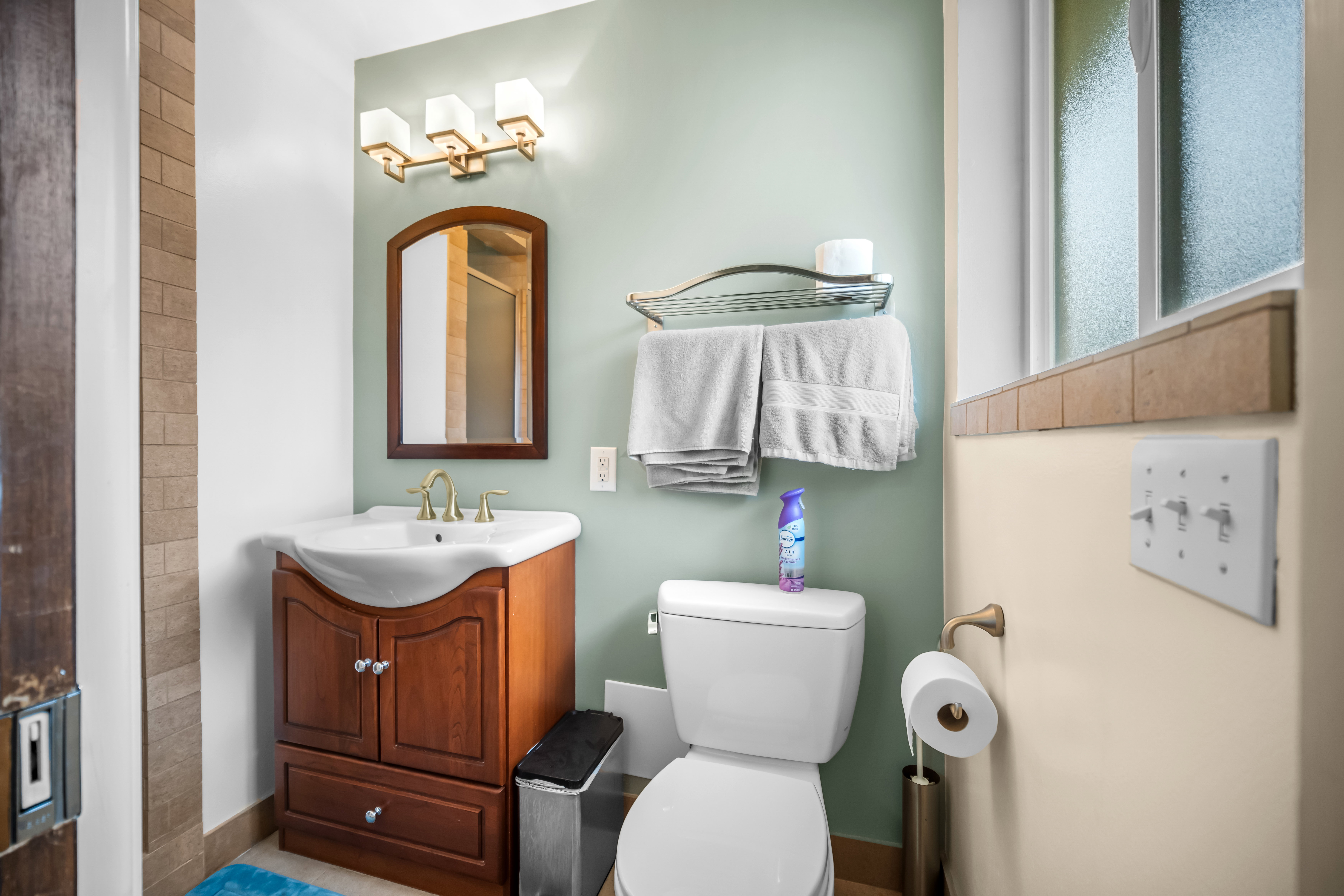 Bathroom featuring vanity and a shower