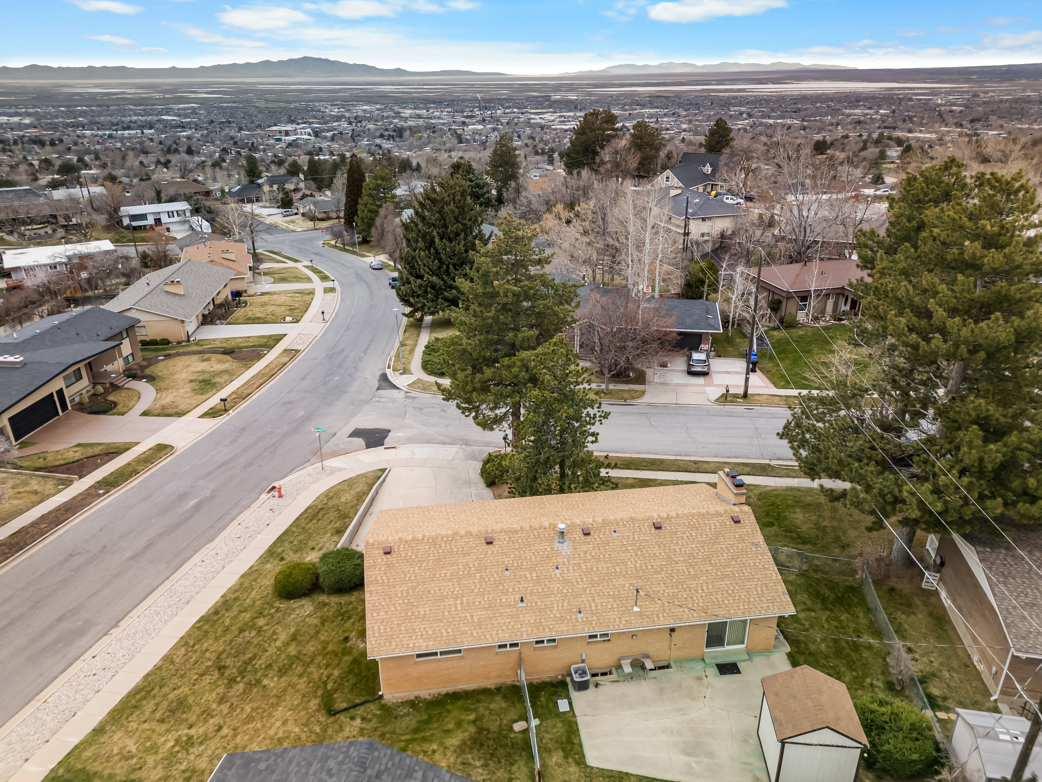Aerial perspective of suburban area with a mountainous background