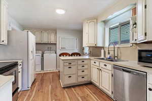 Updated cabinetry, SS microwave, dishwasher and range, along with a newer kitchen faucet