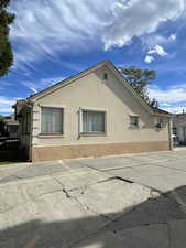 View of property exterior with stucco siding