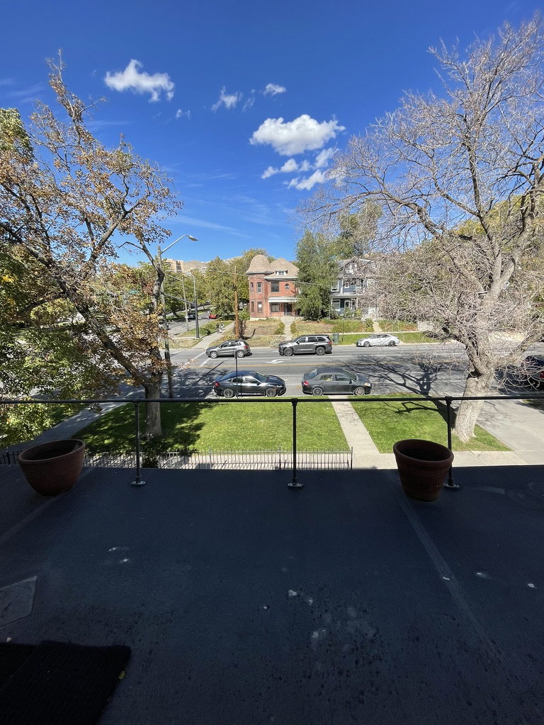 Exterior space with street lights, a residential view, and sidewalks