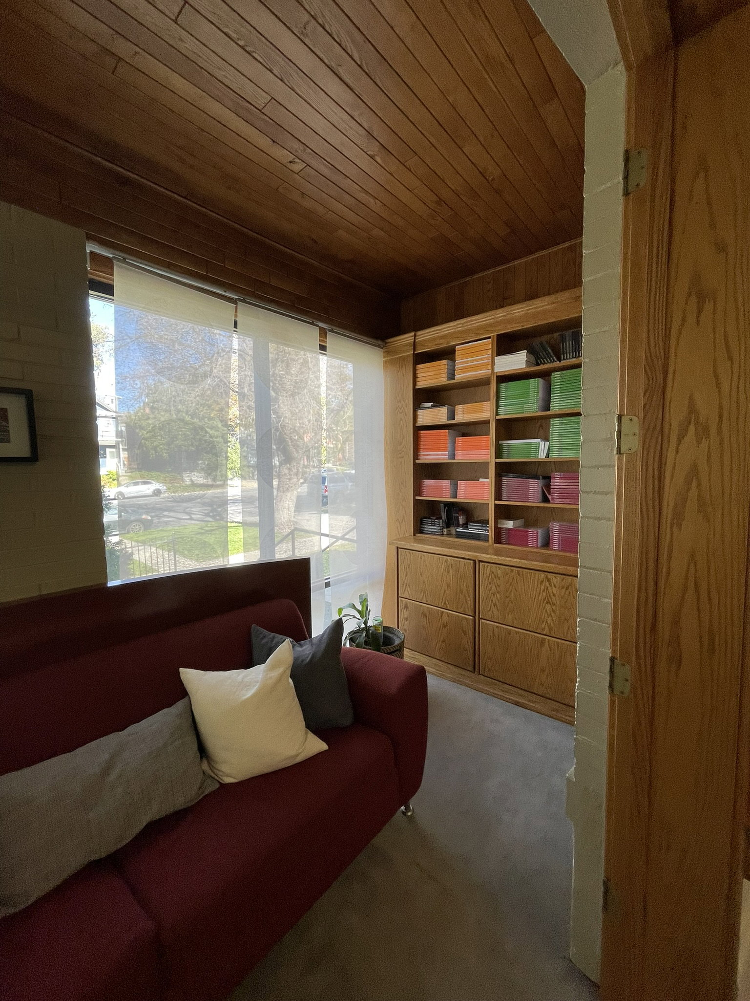 Sitting room with carpet flooring and wood ceiling