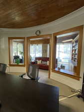 Office space with wooden ceiling and carpet floors