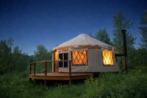 Freestanding yurt with a white fabric exterior