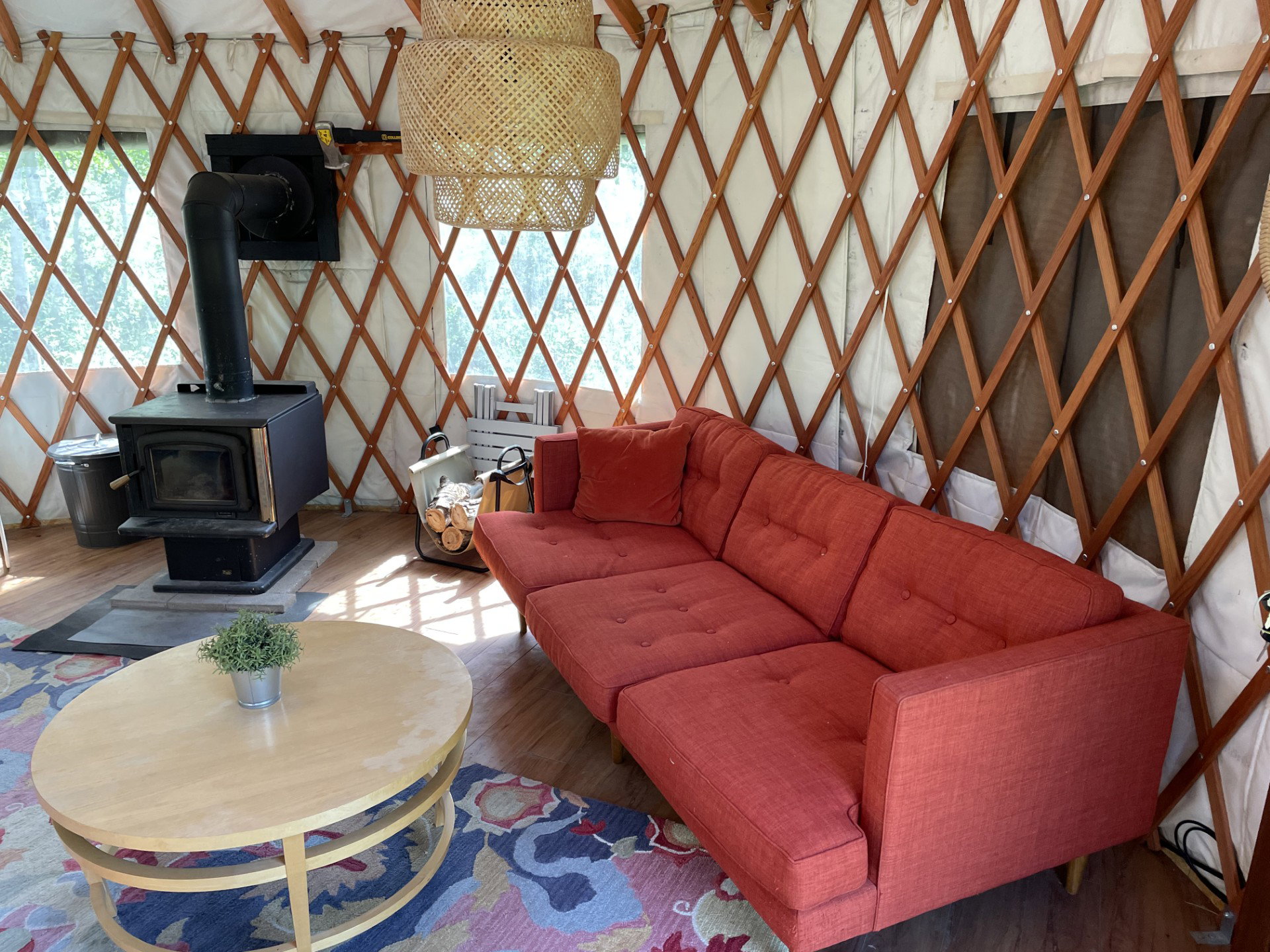 Living area with wood finished floors and a wood stove