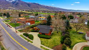 Aerial view of residential area featuring a mountainous background