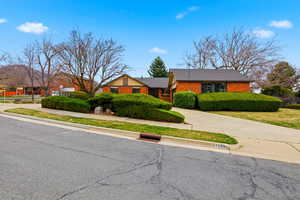 View of front of home featuring brick siding