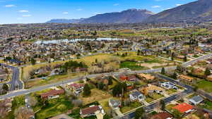 Aerial perspective of suburban area featuring a water and mountain view