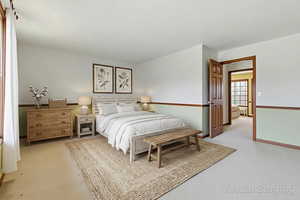 Bedroom with light carpet virtually staged