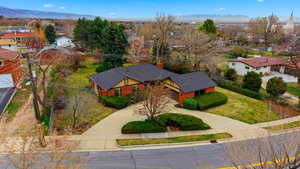 Aerial view of residential area featuring a mountainous background