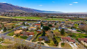 Aerial perspective of suburban area with a mountain backdrop