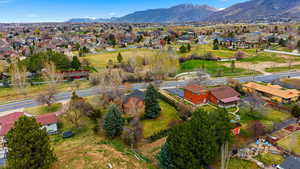 Aerial perspective of suburban area featuring a mountain backdrop
