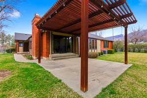 View of patio with a mountain view, a pergola, and entry steps