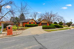 Ranch-style house with driveway and a garage