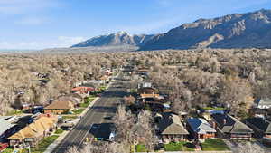 View of mountain backdrop featuring nearby suburban area