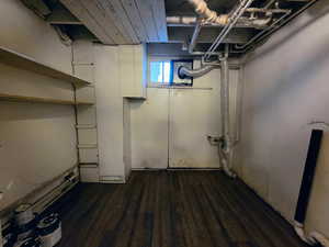Below grade area with dark wood-style flooring