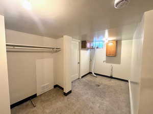 Finished basement with baseboards and light flooring
