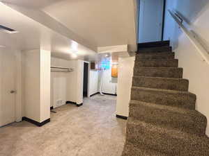 Staircase featuring baseboards