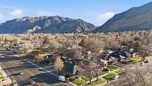 View of mountain backdrop featuring nearby suburban area