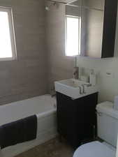 Bathroom featuring vanity and shower / tub combination