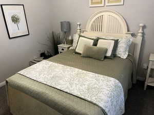 Bedroom with carpet and baseboards