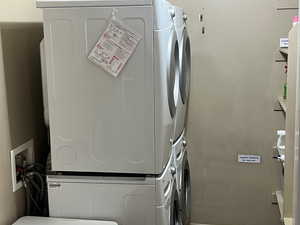 Laundry room featuring stacked washer / dryer