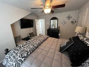 Bedroom featuring baseboards and a ceiling fan