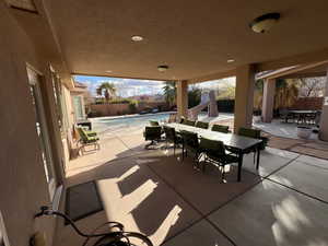 Fenced backyard with a patio and outdoor dining space