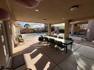 Fenced backyard with outdoor dining area and a patio area