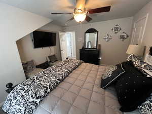 Bedroom featuring baseboards and a ceiling fan