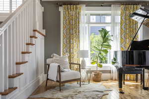 Living area featuring stairway and hardwood / wood-style flooring