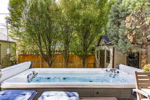 View of patio / terrace with a hot tub