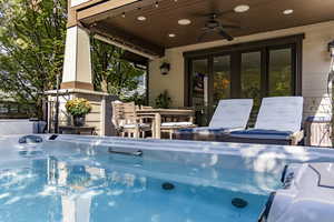 View of pool featuring patio surround, outdoor dining area, a pool, and french doors