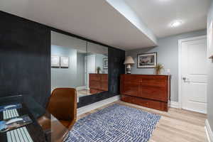 Office featuring light wood-type flooring and baseboards