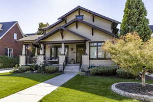 Craftsman inspired home with a porch and a front yard