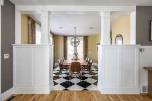 Dining space with a chandelier and light wood-type flooring