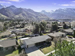 Aerial perspective of suburban area featuring a mountain backdrop