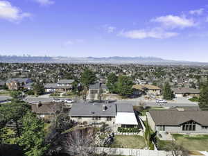 Aerial perspective of suburban area with a mountain backdrop