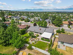 Aerial perspective of suburban area featuring a mountainous background