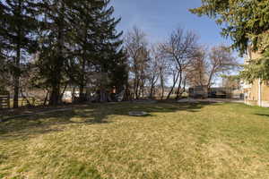 Fenced yard featuring a patio