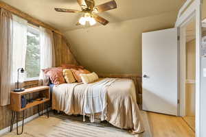 Bedroom featuring a ceiling fan and light wood finished floors