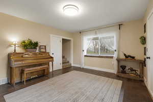 Living area featuring dark wood-style floors