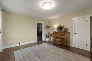 Living area with dark wood-style flooring