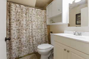 Full bath featuring a shower with curtain and vanity